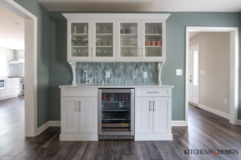 counter with small sink and a wine cooler